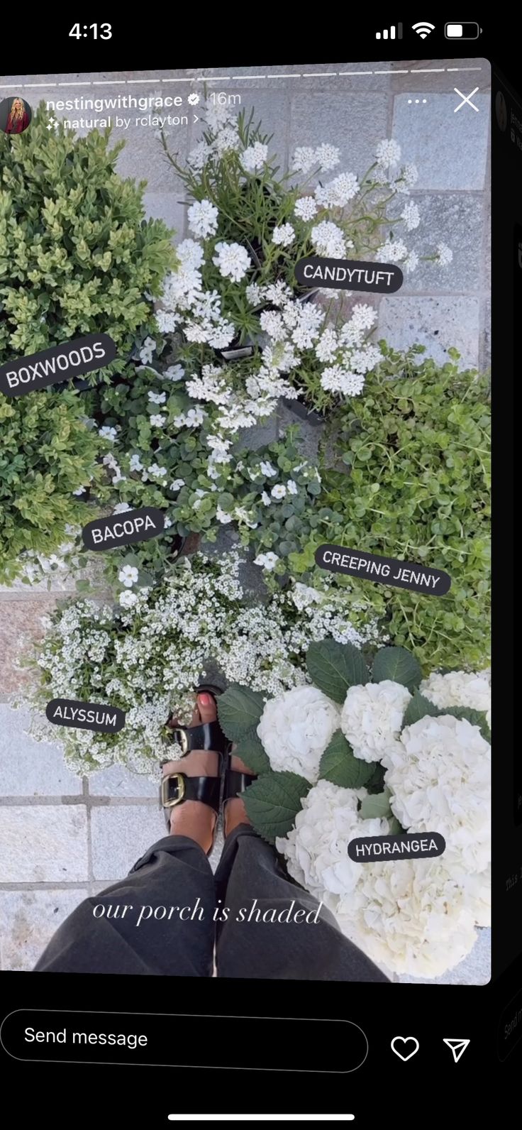 someone's feet are shown with flowers and words on the wall in front of them