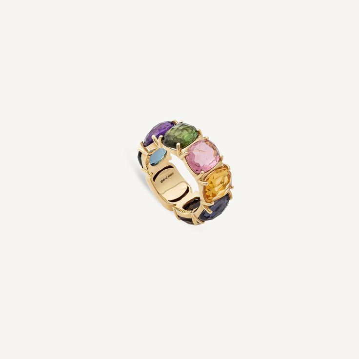 Carefully selected multicolored gemstones give character and brilliance to this magnificent ring. The 18K yellow gold is finely hand-engraved with the ancient Florentine technique. Luxury Multicolor Oval Gemstones, Luxury Multicolor Gemstones With Accents, Luxury Multicolor Multi-stone Sapphire Ring, Luxury Multicolor Multi-stone Gemstones, Fine Jewelry Yellow Gold Rings With Stones, Luxury Yellow Gold Ring Gemstone, Heirloom Multi-stone Yellow Gold Gemstones, Luxury Yellow Gold Rings With Stones, Luxury Rings With Stones