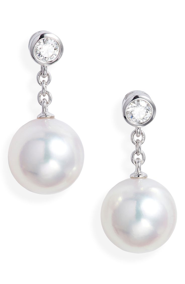 Bezel-set diamonds anchor these cultured pearl drop earrings that swing and sway from dainty 18-karat gold chains. Total diamond weight: 0.16ct. Color: F–G Clarity: VS1 Pearl size: 8–8.5mm Cultured pearl/18k gold/diamond Made in Japan >Diamond Guide Asian Owned/Founded Mikimoto Pearl Earrings, Mikimoto Earrings, Mikimoto Pearls, Pearl And Diamond Earrings, Diamond Guide, Bezel Set Diamond, Diamond Drops, Pearl Diamond, Diamond Drop Earrings