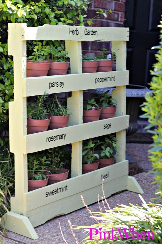 several different types of wooden pallets with plants in them