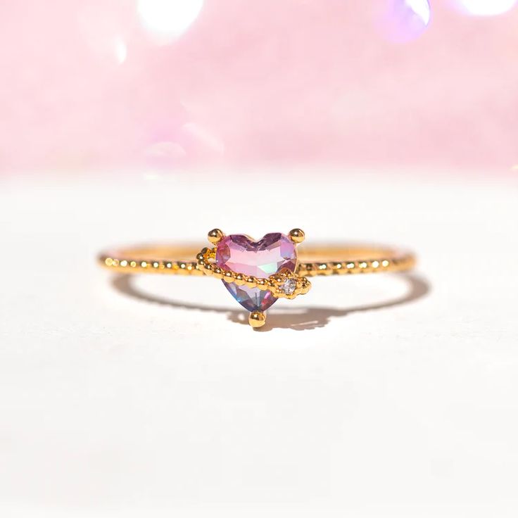 This ring is a keeper! Spread the love in this dazzling ring! 18k gold plated, 18k rose gold plated, or rhodium plated with a protective coating Cubic zirconia stones Available in sizes 5-8 Approx 7mm width Shop our entire Gradient Stones Collection here! Open Crystal Ring For Promise, Adjustable Pink Rings For Proposal, Pink Adjustable Heart Ring For Promise, Adjustable Pink Heart Ring For Promise, Open Crystal Ring For Valentine's Day Promise, Valentine's Day Promise Ring Jewelry With Open Ring Shape, Valentine's Day Promise Diamond Open Ring, Fine Jewelry Sparkling Stackable Rings As Gift, Fine Jewelry Stackable Sparkling Rings