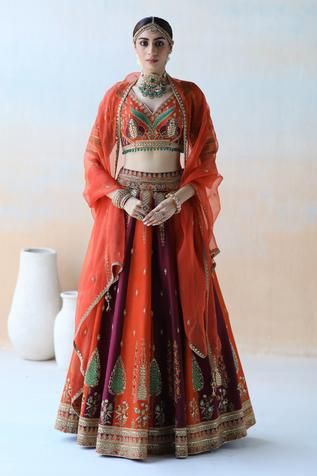 Fire orange, burgundy lehenga with floral, sequin embroidery. Paired with blouse and organza dupatta.
Component: 3
Pattern: Embroidery
Type Of Work: Floral, sequin
Neckline: V neck
Sleeve Type: Half
Fabric: Dupion silk, organza
Color: Orange, Maroon
Other Details: 
Sheer dupatta
Tassel bordered blouse
Back cut-out blouse
Occasion: Bride - Aza Fashions Rust Lehenga, Floral Thread Embroidery, Pink Sharara, Purple Lehenga, Gold Lehenga, Ghaghra Choli, Yellow Lehenga, Lehenga Designs Simple, Lehenga Blouse Designs