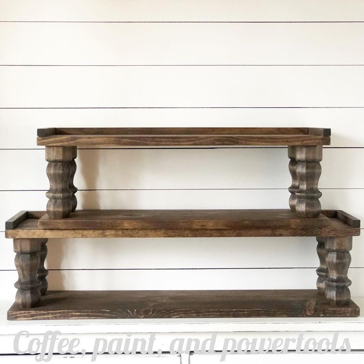 two wooden shelves on the side of a wall