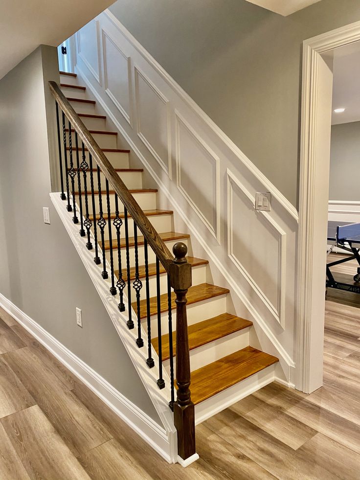 staircase with custom trimwork Stairway Trim Wainscoting, Stair Wall Moulding Ideas, Staircase With Molding, Stairway Molding Trim Work, Wainscoting For Stairs, Wall Trim On Stairs, Wall Trim Staircase, Waynes Coating Staircase, Staircase Molding Ideas