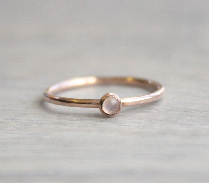 Beautiful birthstone stacking rings. Made in 14k rose gold filled and stone is a 3mm genuine rainbow moonstone. This ring is made to order in your size. If you don't see your size available please feel free to message me. All orders ship in a gift box. If you are ordering multiple items and want them boxed separately, please let me know in the notes at checkout. I ship via USPS. Please review the estimated delivery date and processing times. Processing times vary based on how busy my shop is at Minimalist Rose Gold Moonstone Ring As Gift, Delicate Rose Gold Moonstone Ring, Dainty Rose Gold Stackable Rings With Gemstones, Minimalist Rose Gold Stackable Rings With Gemstones, Minimalist Rose Gold Stackable Gemstone Rings, Dainty Rose Gold Moonstone Ring, Dainty Rose Gold Moonstone Ring Gift, Minimalist Rose Gold Moonstone Promise Ring, Delicate Rose Gold Moonstone Birthstone Ring