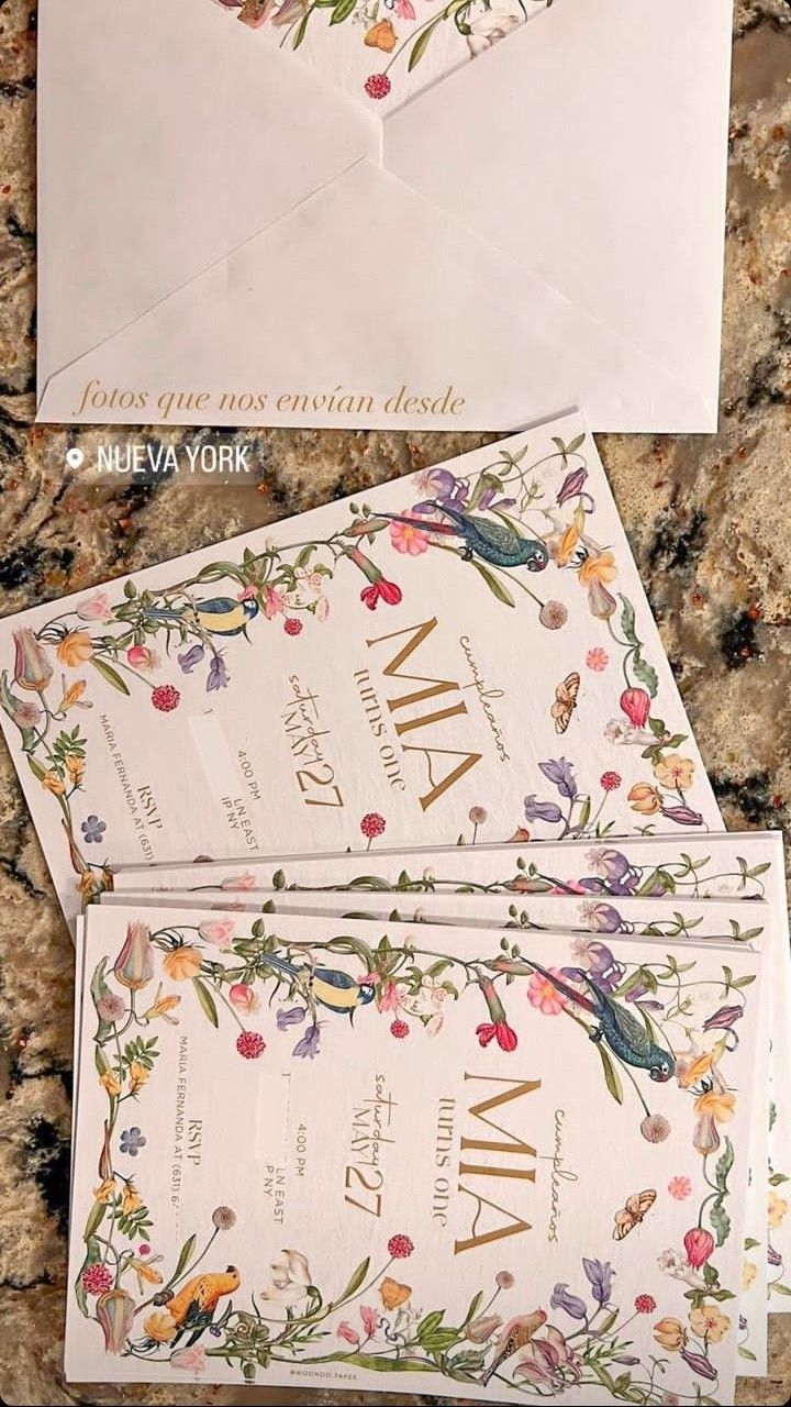 two envelopes with floral designs on them