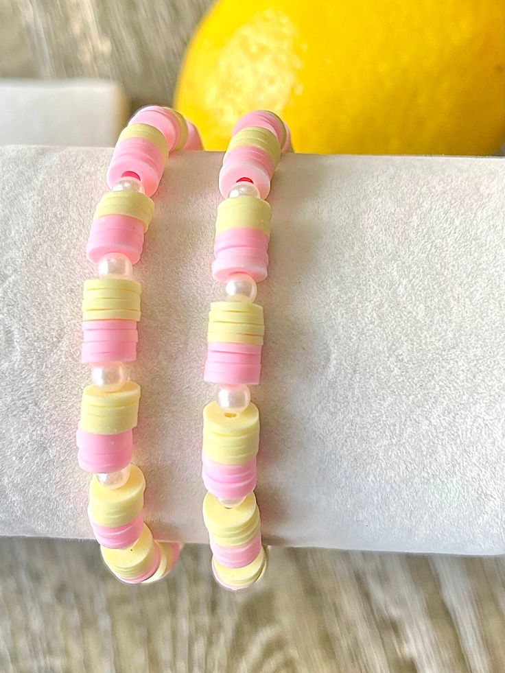 Beautiful, fun, happy bracelets.  Pink Lemonade theme.  Choose your perfect bracelet or stack today!  Listing is for one (1) bracelet. Please include personalization details in the personalization box if you would like it personalized.   Please specify the color or the symbols (if any) if different from the ones displayed. The standard adult size for all bracelets is approximately 6.75 inches. If you need a custom size, please include it in the personalization box. To measure your wrist, place a string around the wrist and measure it against a ruler.  *Standard size will be sent if no size is included in the personalization box*  These bracelets make great, fun gifts for birthdays, brides to be, bridesmaids, friends, party favors, baby showers, bachelorette parties, teachers, Mother's Day, Bracelet Set Ideas, Make Clay Beads, Colorful Bead Bracelets, Pony Bead Bracelets, Preppy Bracelets, Beaded Braclets, Homemade Bracelets, Friendship Bracelets With Beads, Clay Bracelet