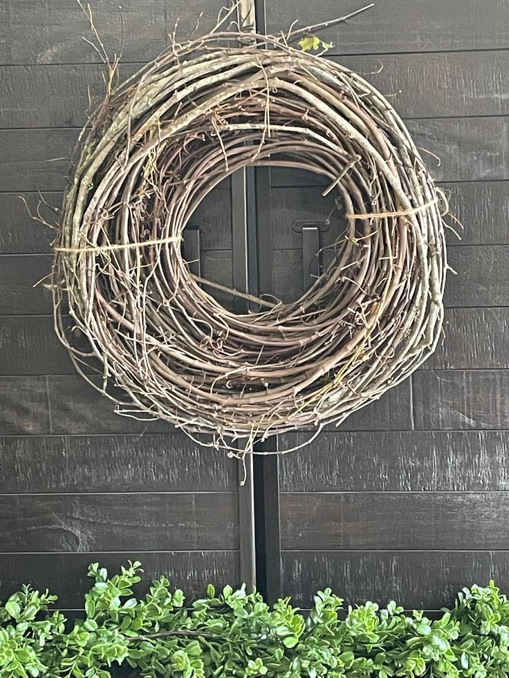 a wreath hanging on the side of a building