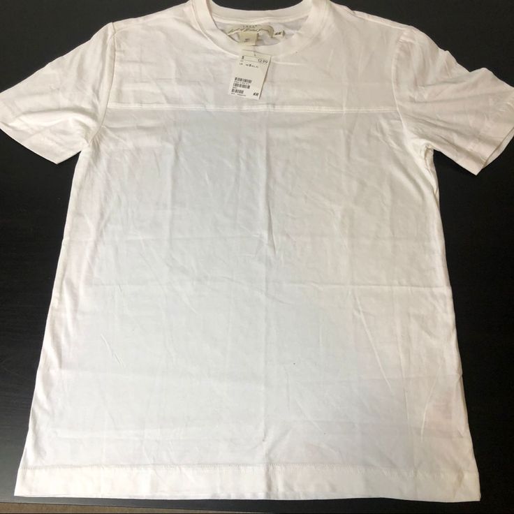 H&M White Textured Short Sleeve Tee This H&M Short Sleeve Tee Is Brand New With The Tags. Men’s Size Small. L.O.G.G (Label Of Graded Goods) Brand By H&M. H&m Short Sleeve Work Tops, H&m Short Sleeve Tops For Work, Basic Short Sleeve T-shirt By H&m, H&m Cotton T-shirt With Relaxed Fit, Basic H&m Short Sleeve T-shirt, H&m Basic Short Sleeve T-shirt, H&m Cotton T-shirt Relaxed Fit, H&m Cotton Relaxed Fit T-shirt, H&m Relaxed Fit Cotton T-shirt