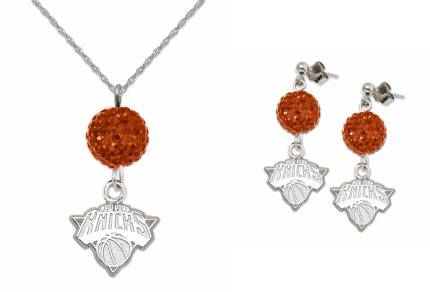 the new york mets necklace and earring set is shown in silver with an orange crystal bea