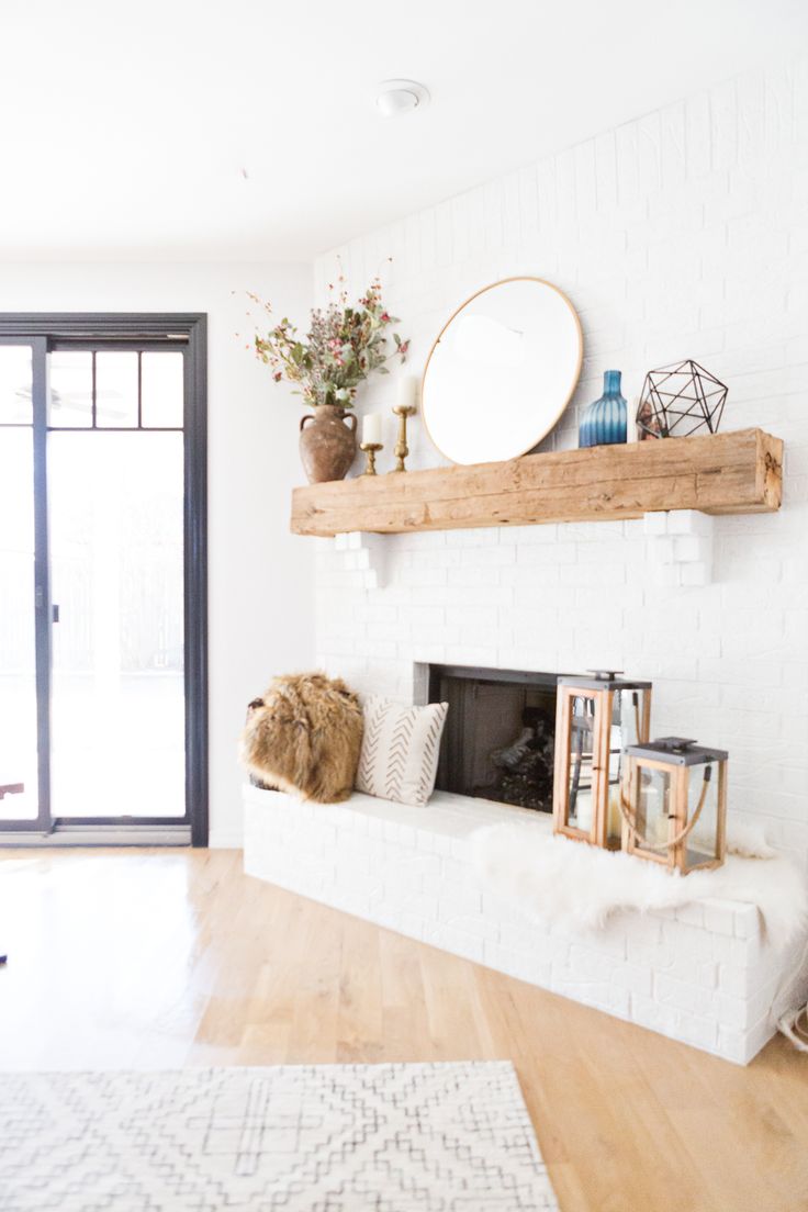 a living room filled with furniture and a fire place