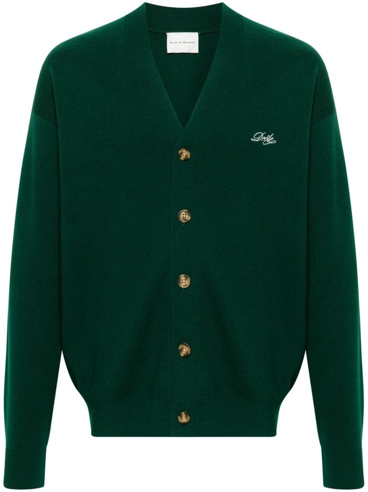 dark green merino wool knitted construction ribbed V-neck embroidered logo at the chest drop shoulder long sleeves ribbed cuffs and hem straight hem front button fastening Green Sweater With Embroidered Logo For Fall, Green Embroidered Logo Sweater For Fall, Fall Green Sweater With Embroidered Logo, Green Fall Sweater With Embroidered Logo, Classic Green V-neck Long Sleeve Sweater, Classic Green Wool Cardigan, Classic Green Wool Sweater, Classic Green Long Sleeve V-neck Sweater, Classic Embroidered Logo Sweater For Winter