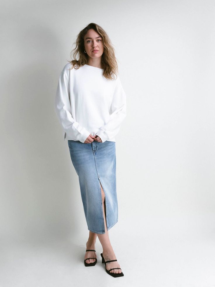 Cozy is the word for this simple basic with a couple of design twists such as side slits and a back yoke line. Pair this back to any of our Capsule bottoms, throw it over a collared shirt, and call it a day'a day full of intentional choices. Versatile Cotton Sweatshirt For Spring, Versatile Spring Cotton Sweatshirt, Casual Tops With Side Slits For Spring, Casual Cotton Sweatshirt For Daywear, Versatile Cotton Sweatshirt For Everyday, Versatile Everyday Cotton Sweatshirt, Casual Stretch Tops With Side Slits, White Collared Cotton Sweatshirt, White Cotton Sweatshirt For Layering