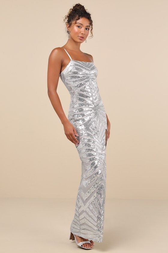 Shine like the queen that you are in the Lulus Glimmering Beauty Silver Sequin Sleeveless Column Maxi Dress! Dazzling silver sequins create an intricate pattern across stretchy mesh knit as it shapes this eye-catching dress that falls from satin adjustable spaghetti straps into a straight neckline and a fitted bodice. The figure-skimming silhouette continues into a column skirt that ends at a maxi hem with a flirty thigh-high side slit. Hidden back zipper/clasp. Fit: This garment fits true to si Silver Sequin Maternity Dress, Silver Long Dress, Sequin Maternity Dress, Best Formal Dresses, Silver Prom Dress, Mac Duggal Dress, Sequin Homecoming Dress, Winter Wedding Guest Dress, Spring Wedding Guest Dress