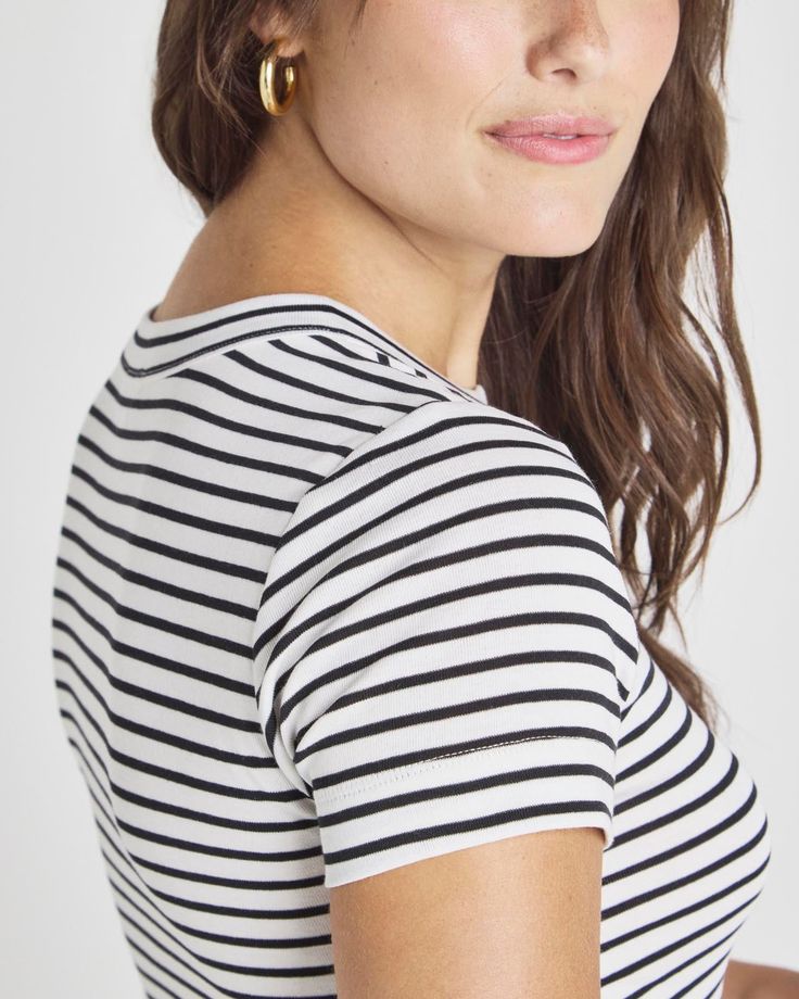 Channel @Cellajaneblog’s signature minimalist style with this collection of elevated essentials designed to help you transition into the season with ease. This crewneck tee deserves a spot in your current stack. Cut from soft jersey, its bodycon fit and classic stripes make it a year-round forever favorite that never goes out of style. The way the stripes curve around the neckline add a slightly unique feel to an everyday classic tee. Striped Crewneck Bodycon Jersey Limited-edition piece from th Elevated Essentials, Striped Crewneck, Signature Collection, Minimalist Style, Out Of Style, Minimalist Fashion, White Light, Going Out, Limited Edition