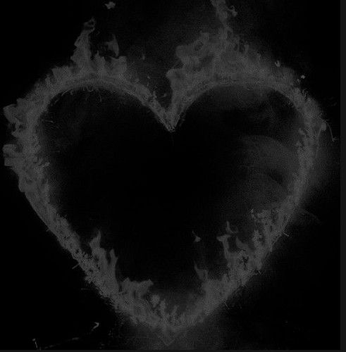 a black and white photo of a fire heart