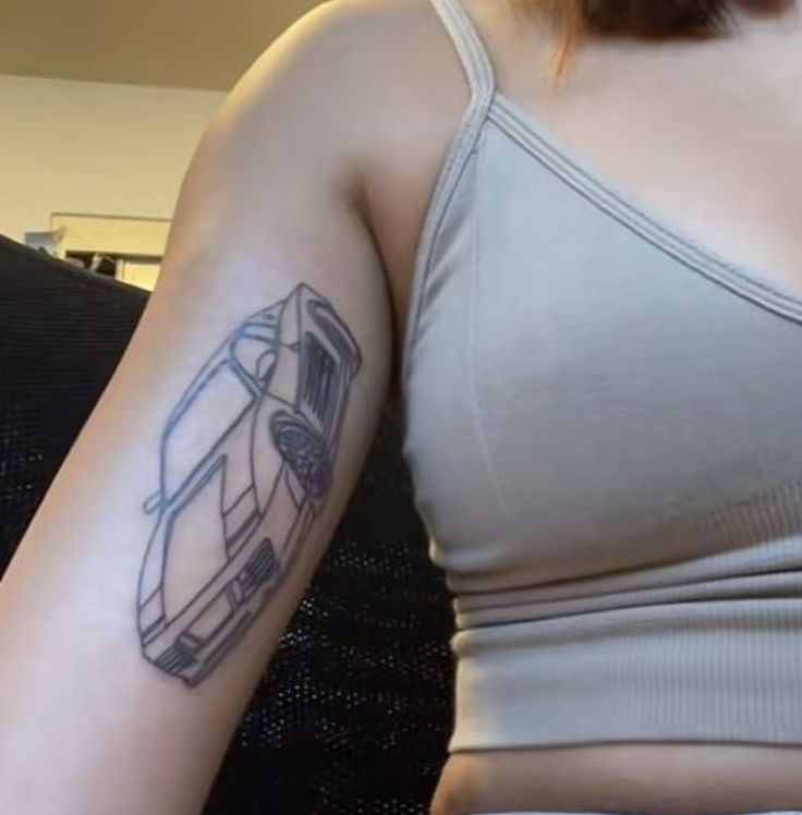 a woman with a tattoo on her arm