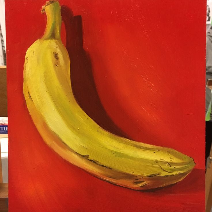 a painting of a yellow banana on a red background with a man in the background