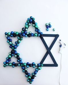 the star of david is made out of beads and other things that are connected to it