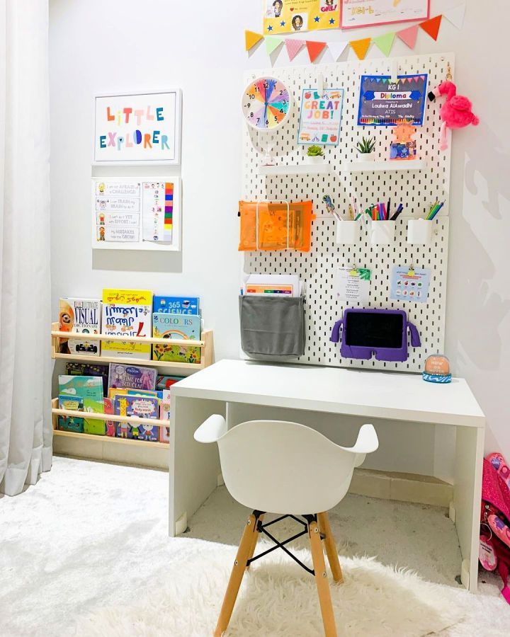 a white desk and chair in a room