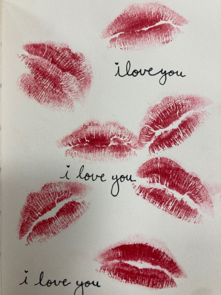 a piece of paper with lipstick imprints on it and the words i love you