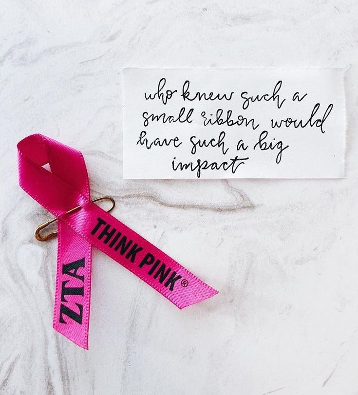 a pink ribbon that says think pink on it with a note attached to the end