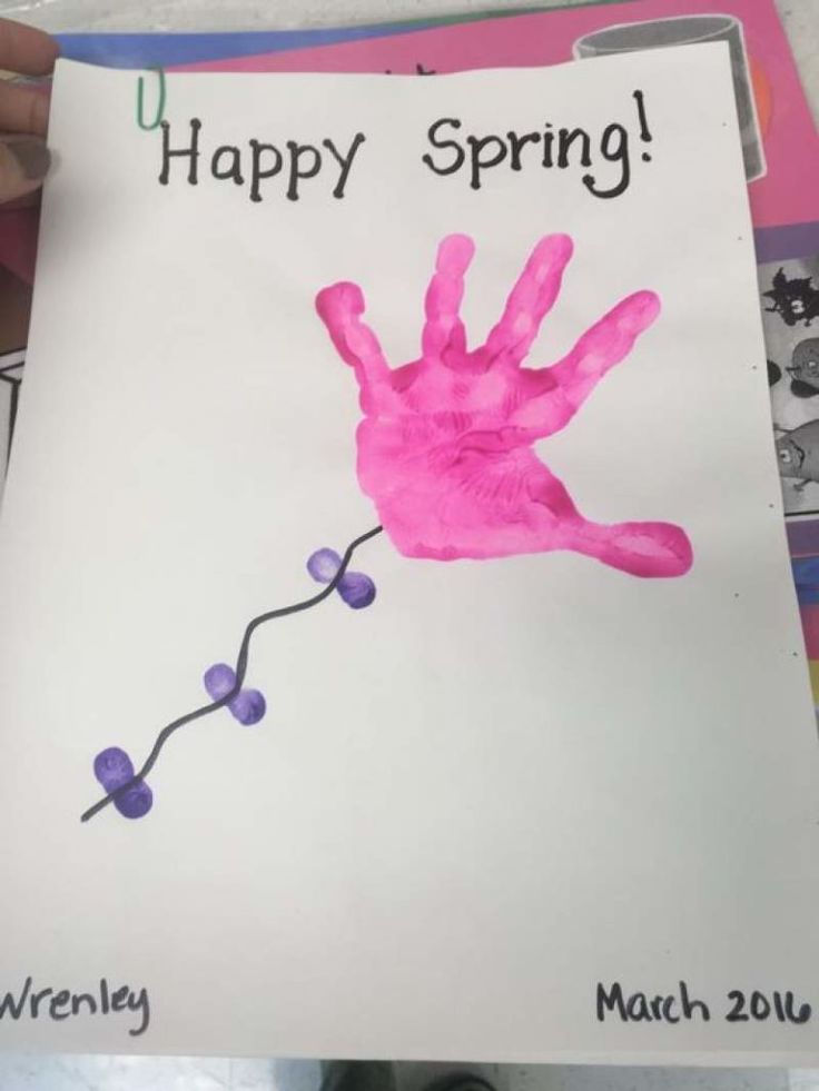 a child's handprint with the words happy spring is displayed on a piece of paper