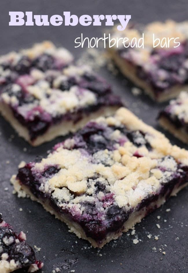 blueberry bars with crumbs are on a baking sheet