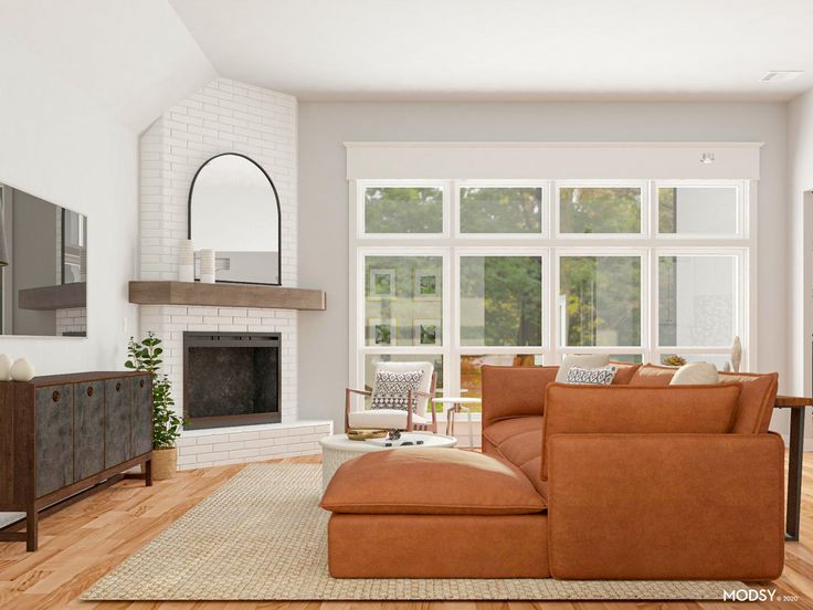 a living room with a couch, chair and fireplace