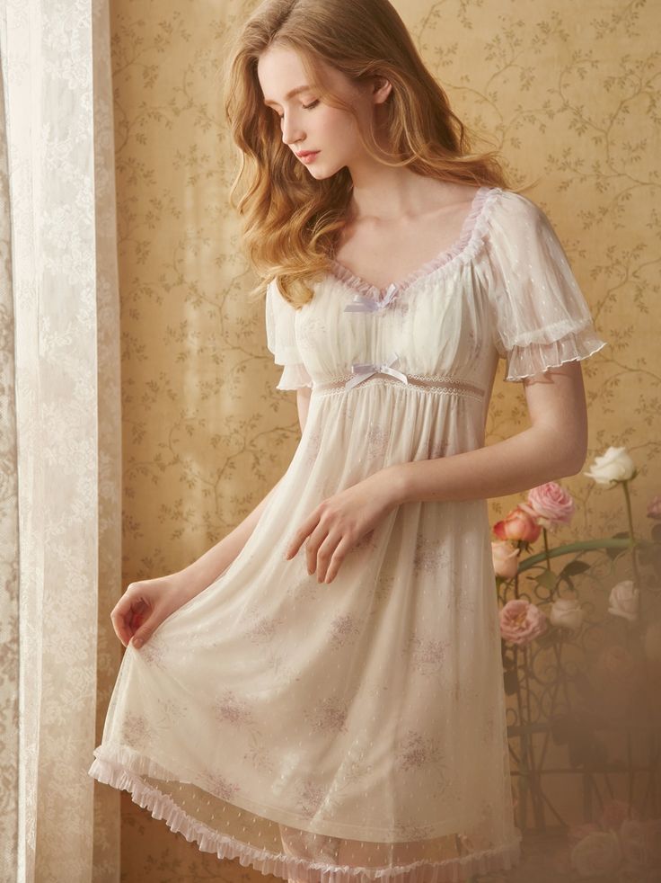 Nightwear with a wisteria purple flower pattern. It has a two-layer structure with transparent tulle fabric, giving it the look of a cute young lady. Her chest is decorated with a ribbon. I think I'll have sweet dreams tonight. 
 
 
 
 Size 
 
 XS size 
 
 Length: 88cm 
 Bust: 80cm 
 Sleeve length: 27cm 
 
 S size 
 
 Length: 90cm 
 Bust: 84cm 
 Sleeve length: 27.5cm 
 
 M size 
 
 Length: 92cm 
 Bust: 88cm 
 Sleeve length: 28cm 
 
 L size 
 
 Length: 94cm 
 Bust: 92cm 
 Sleeve length: 28.5cm Floral Lace Sleepwear, Lace Sleepwear With Floral Print, Feminine Lace Patchwork Sleepwear For Summer, Feminine Summer Sleepwear With Lace Patchwork, Cute Lace Trim Sleepwear, Feminine Ruffled Sleepwear, Purple Sleepwear For Wedding Night, Purple Lace Fitted Sleepwear, Purple Sleepwear For Wedding Night In Summer