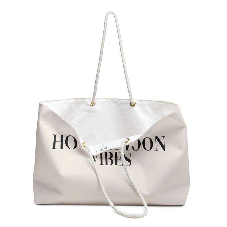 Embrace Honeymoon Bliss with Our 'Honeymoon Vibes' Tote. Whether strolling along sandy shores or exploring new destinations, this spacious tote embodies honeymoon chic, offering ample room for essentials while exuding effortless style. .: One size: 24" x13" (60.9 cm x 33 cm).: 100% Spun Polyester.: T-bottom.: Cream sheeting interior lining.: NB! Size tolerance 0.75" (1.9 cm)).: Assembled in the USA from globally sourced parts Sand-colored Travel Bags For Beach Season, Trendy Beige Beach Bag For Travel, Trendy Beige Weekender Bag For Travel, Beige Large Capacity Beach Bag For Travel, Large Capacity Beige Beach Bag For Travel, Canvas Bags With Double Handle For Vacation, Chic Canvas Beach Bag For Travel, Chic White Weekender Bag For Travel, Cream Bucket Bag For Beach Travel