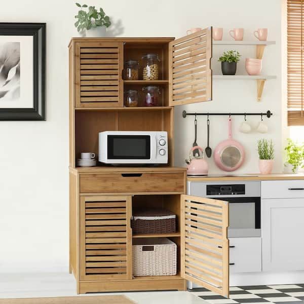 a microwave oven sitting on top of a wooden cabinet