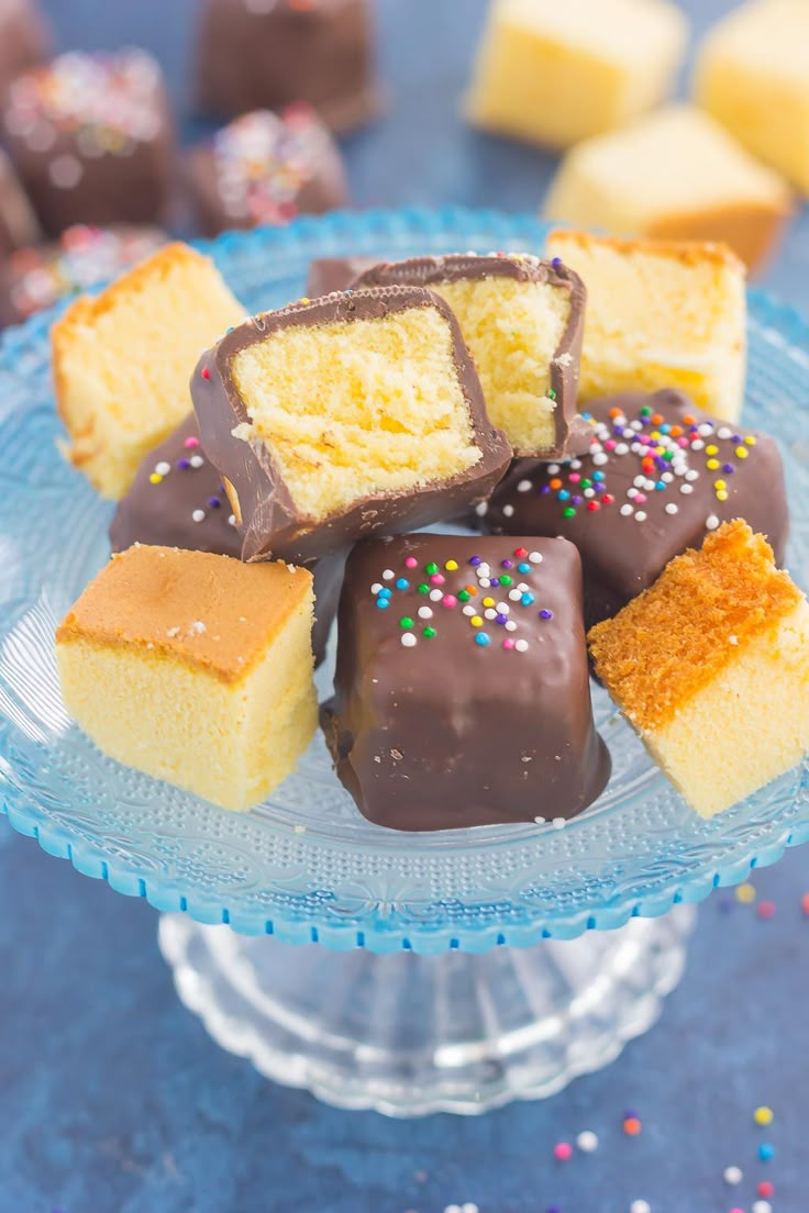 a blue plate topped with lots of different types of cakes