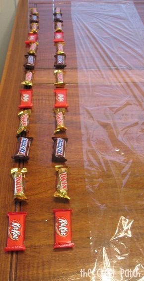 candy bars are lined up on a table