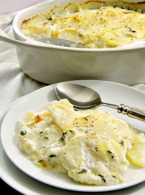 a white plate topped with mashed potatoes next to a casserole dish