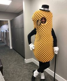 a man dressed in a costume made to look like a banana with glasses and canes