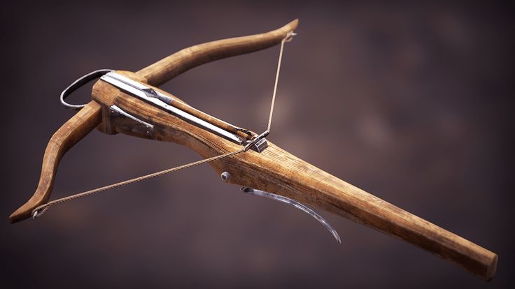 an old bow and arrow on a black background