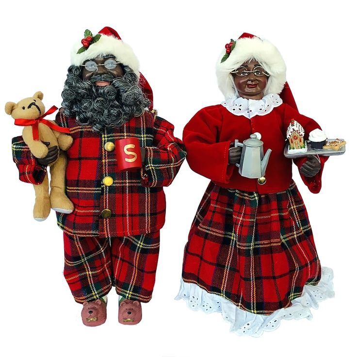 two figurines dressed as santa claus and mrs claus with food in their hands