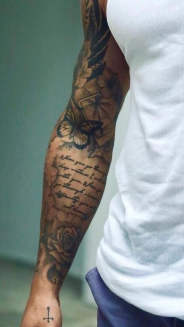 a man with a tattoo on his arm