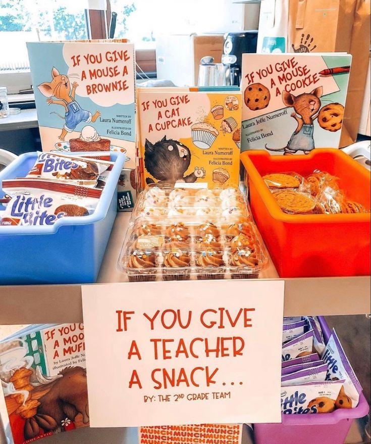 there are many books and snacks on the table for children to read or eat together