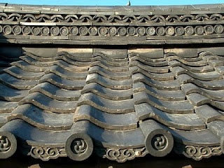 an old roof with decorative designs on it