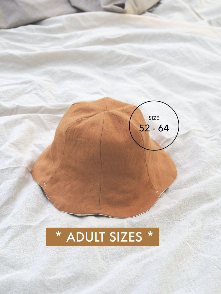 an adult size hat on top of a bed