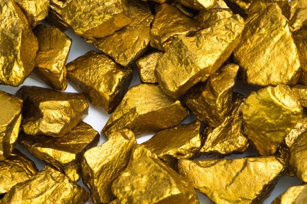 gold nuggets are shown in this close up photo, which appears to be made from real gold nuggets