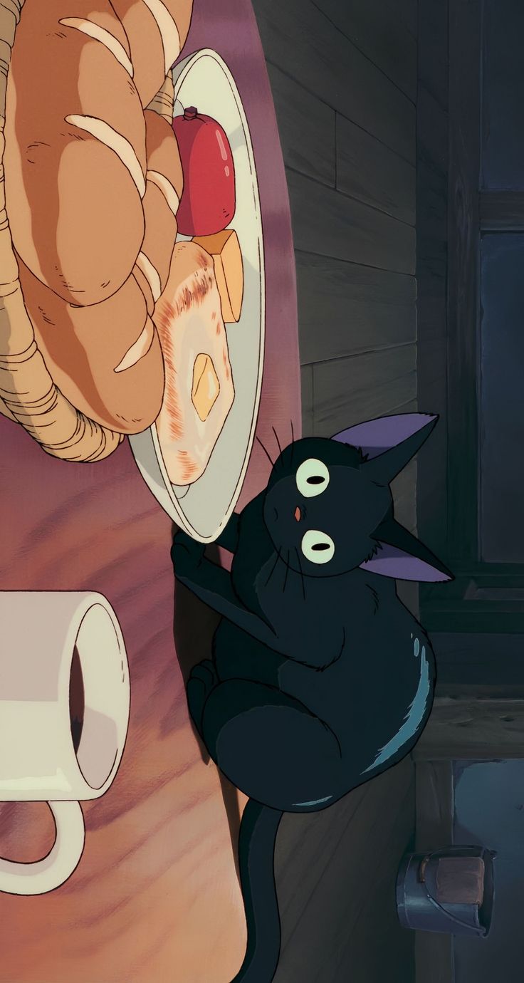 a black cat sitting on top of a table next to a piece of bread and apple