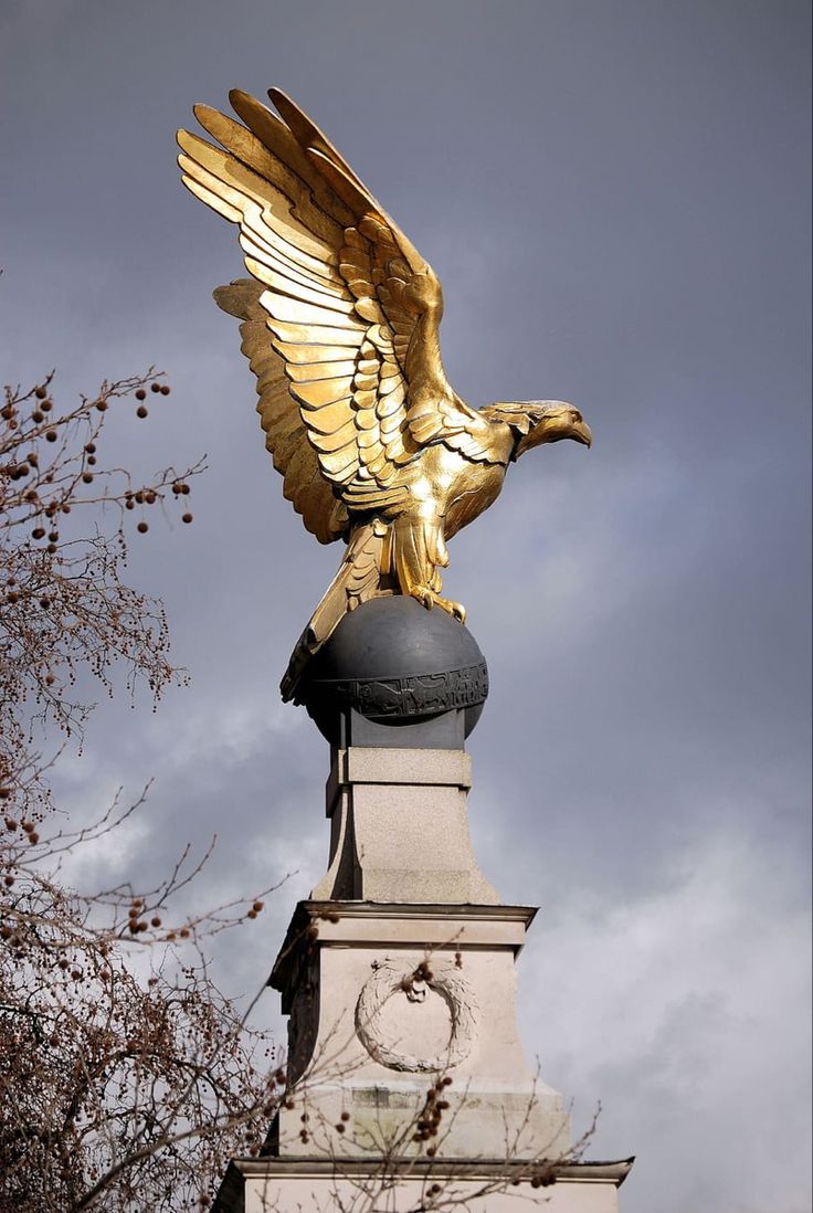 an eagle statue on top of a building with the words are you vigilant and strong in your life?