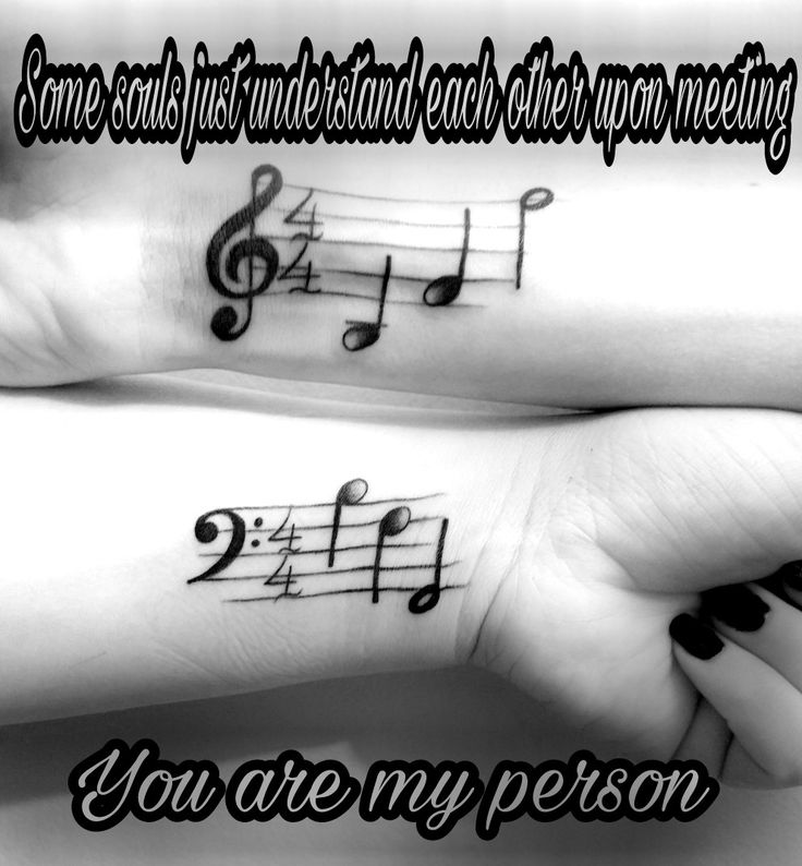 two wrist tattoos with musical notes on them and the words, you are my person