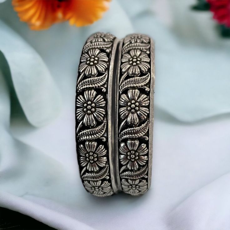 Oxidized lightweight silver bangle pair in floral pattern. Inspire your style with this beautiful Indian ethnic bohemian style tribal jewelry this festive season.  All orders Ship same day if placed before 4:00 PM EST  Create beautiful memory for any occasion with elegant jewelry for your loved ones We will be happy to navigate you through the process so if you have any questions regarding our product before placing an order reach out to us and we will be there to help you.  Thank you for your v Silver Tilla Bangle For Festivals, Silver Bangle With Intricate Design, Silver Tilla Bangle For Festive Occasions, Bohemian Oxidized Wedding Bangle, Silver Engraved Bangle For Festive Occasions, Handmade Silver Bangle For Festivals, Silver Bangle With Oxidized Finish For Festival, Silver Oxidized Bangle For Festival, Silver Bangle With Tilla Detailing As A Gift