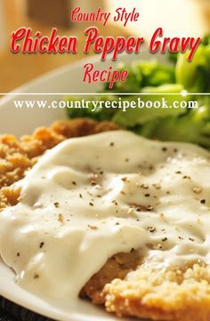 a white plate topped with chicken and gravy next to broccoli on a table