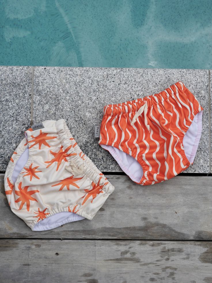 Playful White Bottoms For Pool, Playful White Pool Bottoms, Playful White Swim Trunks For Swimming, Playful White Swim Trunks, Playful White Swim Trunks For Pool, White Swimwear With Upf 50+ For Playtime, Summer Playtime Diaper Cover With Elastic Waistband, Summer Playful Diaper Cover With Elastic Waistband, Playful Summer Diaper Cover With Elastic Waistband