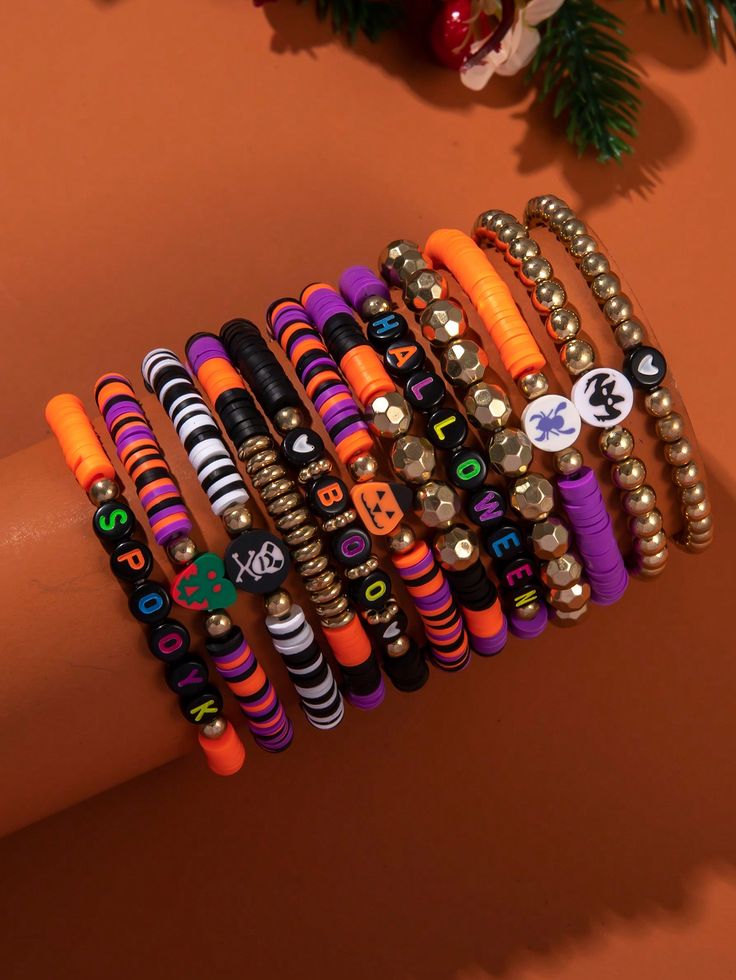 the bracelets are stacked on top of each other in different colors and designs,